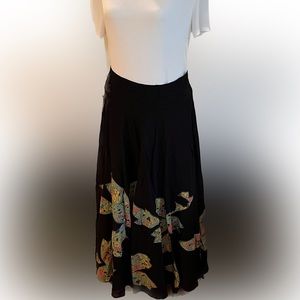 Anthropologie Fei long black skirt with floral embellishments. Size 6.